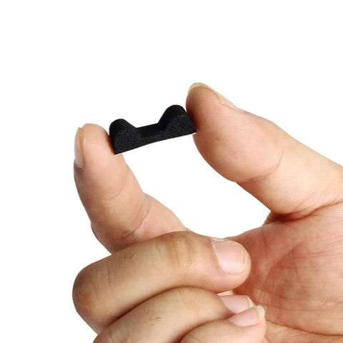 Fingers holding a component of Drop Away Arrow Rest Felt Kit With 2 Pairs Felt Tapes And 2 Arrow Holder Pads Adhesive For Compound Bows