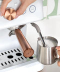 Next Level Semi Automatic Espresso Machine With Badass Built In Grinder And Silky Milk Frother Featuring WiFi App Control Custom Drinks 15 Bar Pump 95 Oz Water Tank Matte White Copper Accents with copper steam wand.