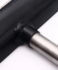 Close-up of a 12-inch stainless steel lathe tool rest with a 1-inch diameter post attached to a black mounting bar.