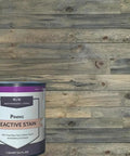 Top Shelf Reactive Wood Stain Featuring Hella Rustic Brown Tones That Deepen With Every Coat For A Killer Aged Finish On Hardwood And Softwood Surfaces In This Massive 5 Gallon Bucket. Can of Pining reactive stain on weathered wood backdrop.