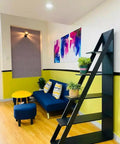 Ladder Bookshelf 5 Tier Industrial Bookcase With Storage Shelves Room Divider Freestanding Display Shelf Black Wood Grain in living room.