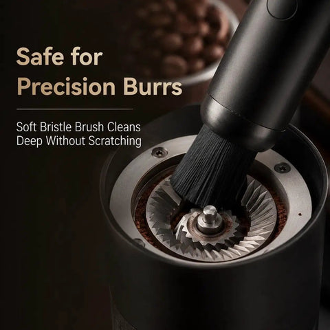 Close-up of Rechargeable Mini Coffee Grinder Vacuum Cleaner with brush attachment cleaning burrs