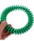 Hand holding a green ring from Colorful Soft Plastic Dive Rings For Pool Training And Safe Underwater Games, Four Pack Water Resistant Dive Gear