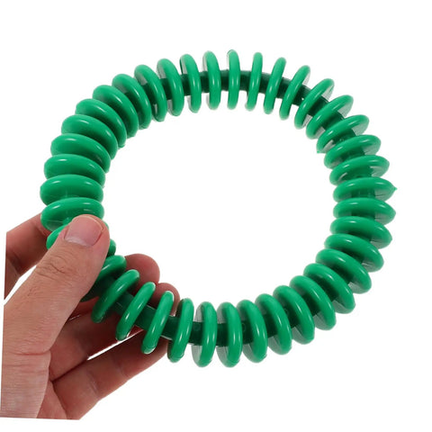 Hand holding a green ring from Colorful Soft Plastic Dive Rings For Pool Training And Safe Underwater Games, Four Pack Water Resistant Dive Gear