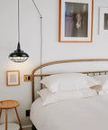 Sick Style Industrial Black Cage Plug In Pendant Light With Dimmable Switch Wall Outlet Fixture above bed for cozy ambient lighting.