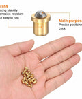 Top Shelf Brass Ball Point Spring Plungers 30 Piece Set in hand, showing brass construction and precision locking features.