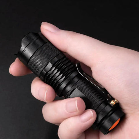 Hand holding compact One Mode Red LED Flashlight High Power Red Light Torch For Night Astronomy Aviation Wildlife Watching
