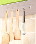 Heavy Duty Self Adhesive Hooks 50 Pack Waterproof Shower Wall Mounts No Drill Damage Free Reusable Utility Holders That Stick Like Crazy And Keep Things Tidy Without The Hassle. Kitchen utensils hanging on clear adhesive hooks.