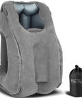 Gray ergonomic inflatable travel pillow shown with carry bag, offers neck support and comfy headrest for long flights or office naps.