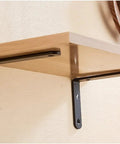Heavy Duty Metal Corner Brackets Built Different Right Angle Floating Shelf Braces No Sweat Diy Home Storage Supports With Screws Black 25X15Cm Wall Mount Braces holding a wooden shelf.