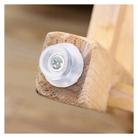 Close-up of 50 Pcs Nail On Rubber Feet For Cutting Boards And Furniture Legs Non Slip Silicone Glider on wooden leg