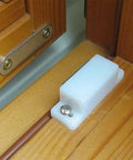 Dope Set Of 5 Magnetic Door Catches For Cabinets Wardrobes Cupboards Super Strong Hold Latches To Keep Doors Shut Tight And Look Cool Around The House. White plastic magnetic latch mounted on wooden cabinet.