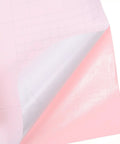 Hassle Free Pink Peel And Stick Wallpaper Roll Waterproof Self Adhesive Removable PVC showing the pink side and backing.