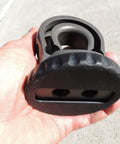 Hella Tough Splice On Synthetic Rope Shackle Mount Featuring Integrated Rubber Pad and Precision Machined Thimble held in hand.
