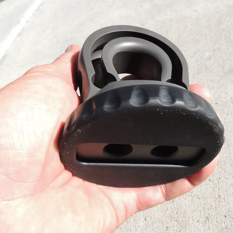 Hella Tough Splice On Synthetic Rope Shackle Mount Featuring Integrated Rubber Pad and Precision Machined Thimble held in hand.