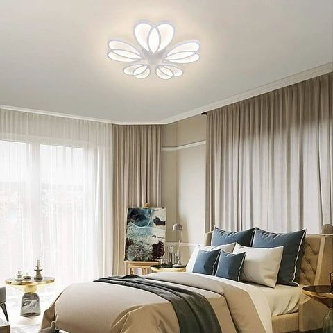 Lit 80W LED Ceiling Light with Remote in flower shape, mounted above a modern bedroom, showing dimmable and changeable color temperature.