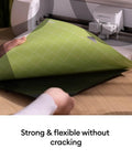 Person holding a Cutting Mat Variety Pack Four 12 By 24 Inch Mats for Crafting Workhorse Set with machine in background.
