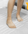 Person standing on Grippy Non Slip Bathtub And Shower Stickers Set 24 Pieces 8 By 0.8 Inch Anti Skid Treads Tape in shower