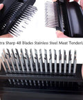 Close-up of Meat Tenderizer With 48 Stainless Steel Needle Blades Heavy Duty Pro Grade Kitchen Tool in black with sharp blades.