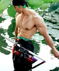 Man wearing Katana Sword Belt For Cosplay And Pirate Adventures, all leather belt with one to three sword sleeves in outdoor setting
