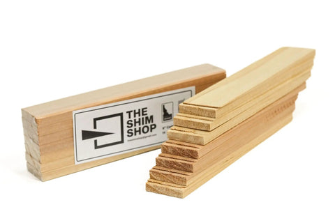 Hella Durable Kiln Dried Cedar Shims Bulk Case 420 Count Rot Resistant 8 Inch Fine Tip Wedges stacked for door leveling.