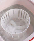 Inside view of the Pink 6 Liter Mini Foldable Washing Machine With Negative Ion Tech Lightweight Portable Clothes Cleaner.