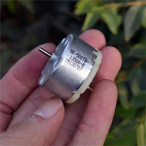Mini 32mm Round Spindle Motor, DC 6V 9V 12V, 5600 RPM, Carbon Brush Motor held in hand showing front view