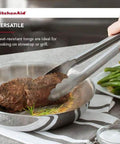 Stainless Steel Utility Tongs 12 Inch With Locking Mechanism in use flipping steak in frying pan