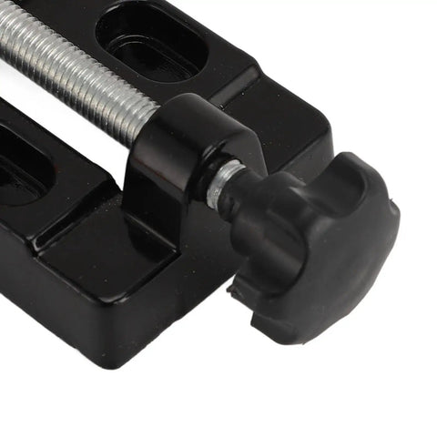 Close-up of Aluminum Alloy Handheld Drill Press Vise Clamp turning knob detail, opens 0-2.1 inches, black finish ideal for crafts.