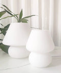 Swirl Mushroom Glass Lamp In Striped Pink, Hand Blown Translucent Murano Style Table Bedside Light on white table.