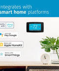 Smart Thermostat With Color Touchscreen WiFi And Mobile App Control Easy DIY Install Privacy Protected Data Works With Alexa Energy Star Certified C Wire Required Black ST75 on wall with integration options.