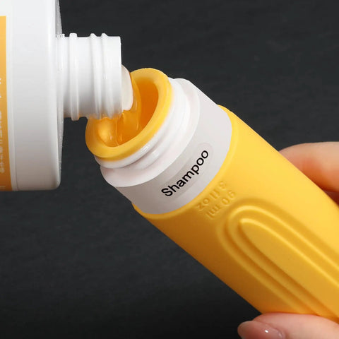 Filling shampoo into yellow On The Go Travel Bottles For Toiletries Set 5 Pack TSA Approved 3oz Leak Proof Refillable Containers