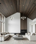 Modern living room with high ceilings, large windows, neutral sofa, and decorative ceiling fixtures.