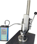 Portable Ultrasonic Hardness Tester With Test Stand And Heavy Gauge Probe measuring steel part on a flat surface.