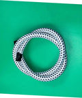 Coiled Extended Length PVC Nylon Steam Hose for High Temperature Garment Steamers Replacement Tube on green background.
