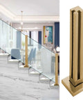 Kickass Heavy Duty Gold Staircase Glass Railing Post System With Square Stainless Steel Balusters And Clamps For Ten Or Twelve Millimeter Glass Kickass Balcony Deck Safety Kit No Sweat Install showcasing gold railing post with glass panels.