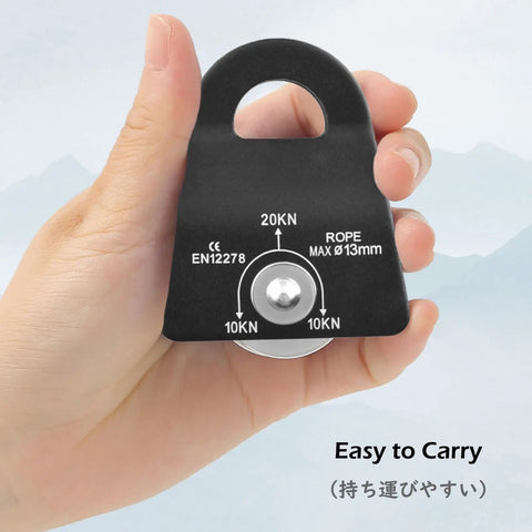 Hand holding Ultra Lightweight 20kN Micro Climbing Pulley With Sealed Bearing Sheave Aluminum Fixed Eye Rope Pulley For Rigging Lifting Tending And Hauling Gear Black