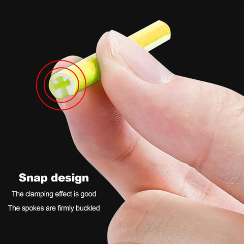 Close-up of a hand holding a snap design bicycle spoke from 72 Pcs Bicycle Spoke Reflective Strips For Night Riding 360 Degree Visibility Fits Bikes Motorcycles EBikes Safe Night Rides DIY Decor And High Visibility Reflectors Cool Silvery Look.