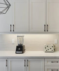Modern kitchen with Matte Black Cabinet Pulls 10 Pack 5 Inch Center To Center Hardware installed on white cabinets and drawers.