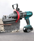 Makita Xcs01t1 18V Lxt Lithium Ion Cordless Rebar Cutter Kit cutting through rebar on concrete with rotating blade.
