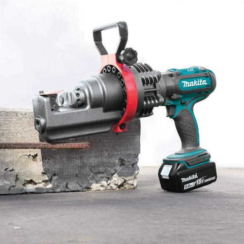 Makita Xcs01t1 18V Lxt Lithium Ion Cordless Rebar Cutter Kit cutting through rebar on concrete with rotating blade.