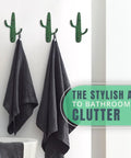 Roll With That Chill Southwest Vibe Using This Set Of Three Rustic Green Cast Iron Cactus Wall Hooks holding towels in bathroom.