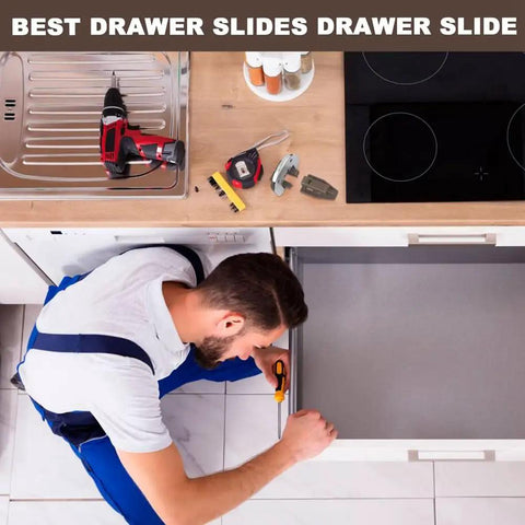 Man installing undermount drawer slides replacement kit with rollers, tools and guides on a kitchen counter.
