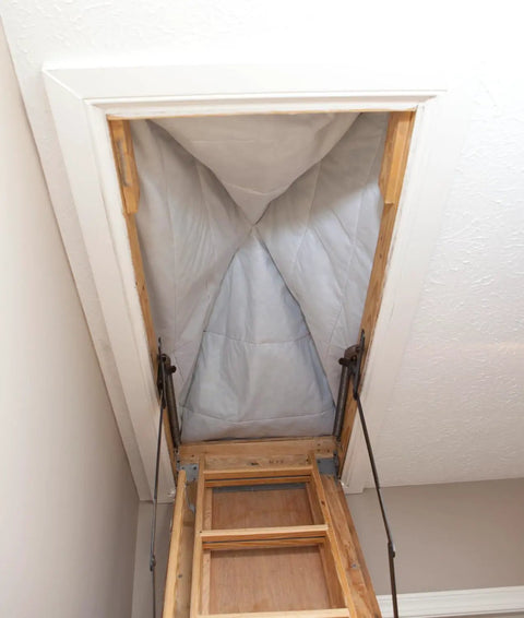 Stairway Attic Draft Cover for Openings Up To 25.5 By 54 Inches, installed view, showing energy-saving insulation seal in attic opening.