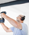 Person using Kickass Cordless Impact Drill And Driver With Brushless EC-TEC Motor 18V System for mounting screws.