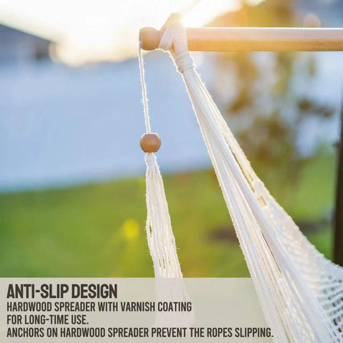 Close-up of hardwood spreader bar on Caribbean Style Hammock Chair With Spreader Bar, XL Rope Hanging Chair in sunlight.