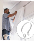 Man installing curtains with 60 Pack Plastic Circular Curtain Rings For Rods With Smooth Glide No Burr, easy install