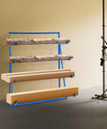 Legit Heavy Duty Steel Cantilever Storage Rack With 440 Lb Capacity adjustable arms displaying wooden planks and logs.