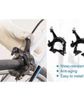 Deadly Smooth Road Bike V Brake Set Featuring Heavy Duty Mechanical Dual Pivot Calipers With Tough Aluminum Alloy Housing For Grip Tight Front And Rear Wheel Control In Sleek Black installed on a bike wheel.