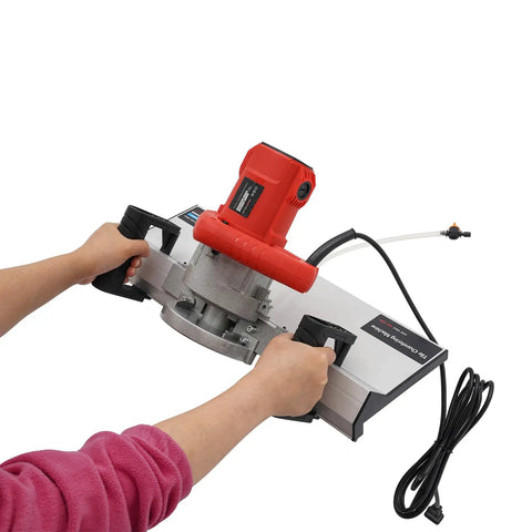Hands using Heavy Duty Tile Beveling Machine With 43 Degree Chamfer, 1200W 13000RPM, Water Cooling System, red motor, close up view.